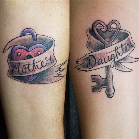 Badass mother daughter tattoos - Celebrate the special bond between parents and daughters with meaningful tattoos. Explore beautiful designs and find inspiration for your own parent-daughter tattoo. 